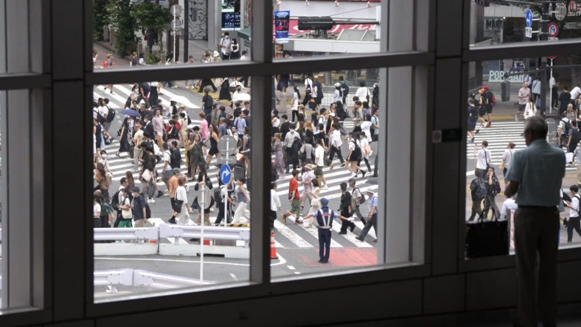 Japan Q4 GDP revised up to slight expansion, economy avoids recession