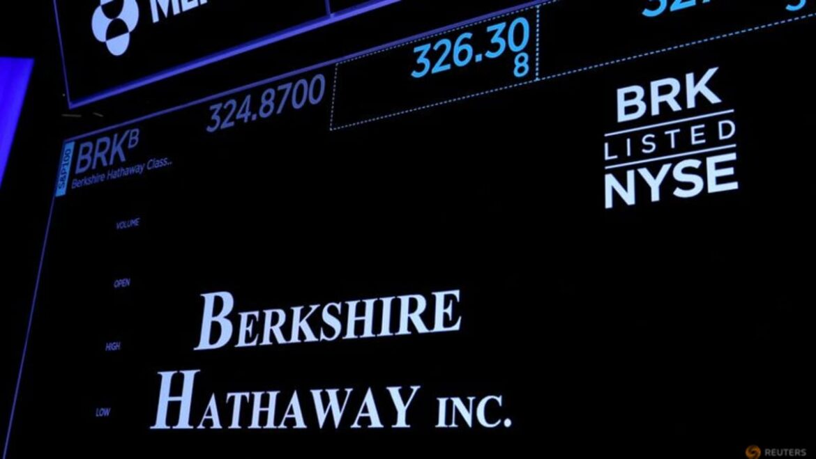 Berkshire pares huge Apple stake as cash, operating profit set records