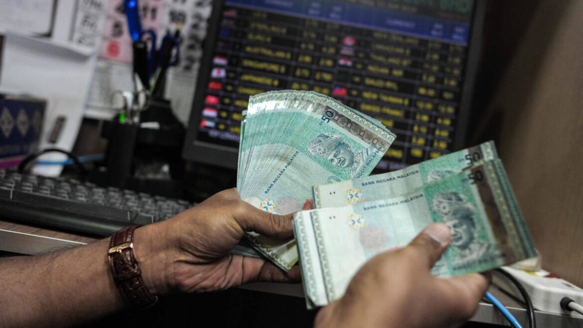 Malaysia’s currency woes spur financial stress, political discontent. Will the ringgit rise again?